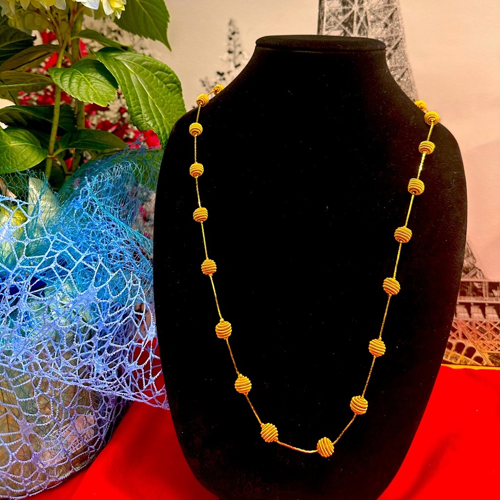 Gold tone necklace with pearls